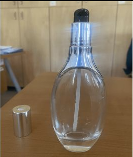120 ml glass pump bottle: heading 8479 and a date warning